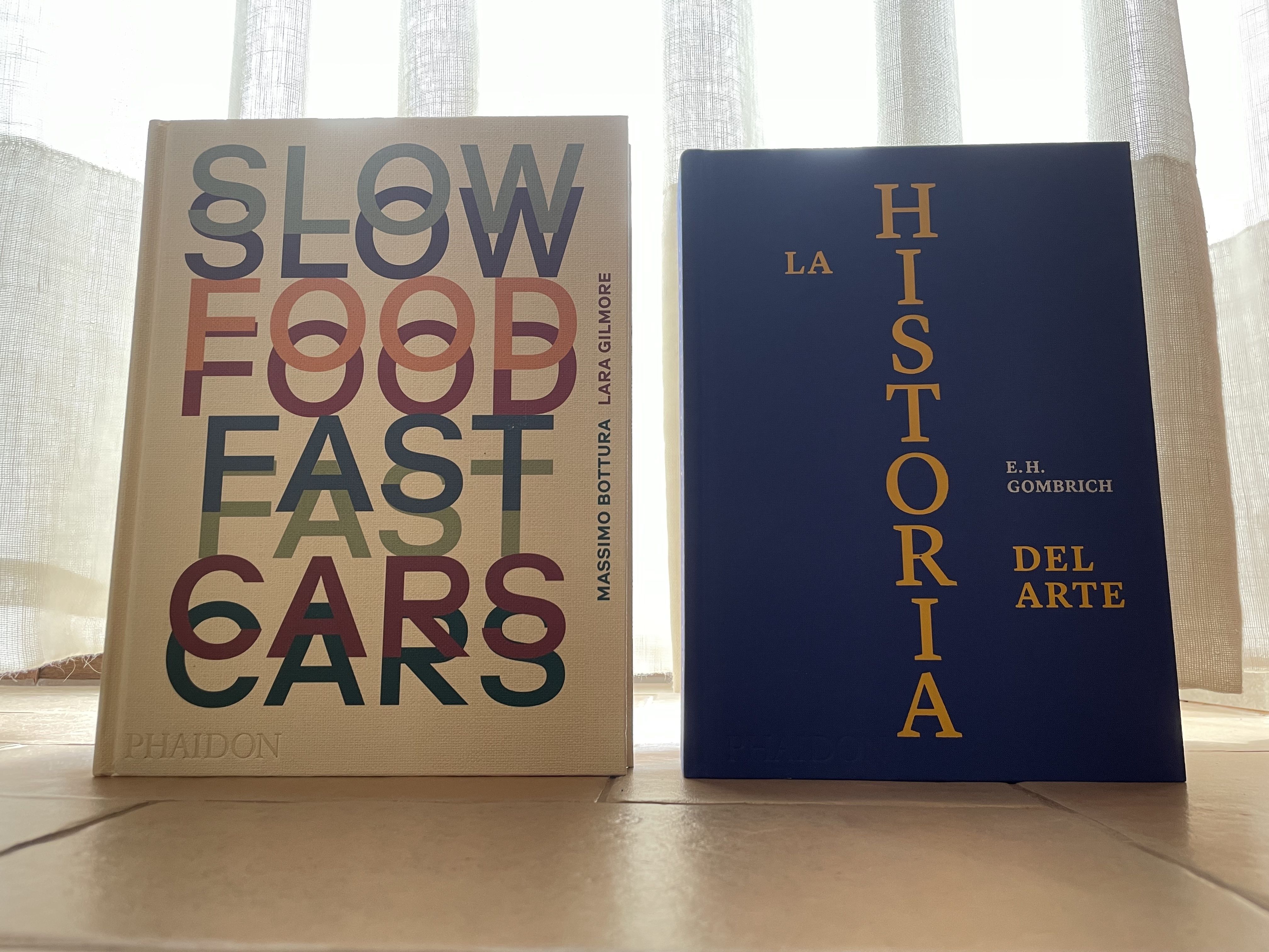 Los libros de la editorial Phaidon 'Slow Food, Fast Cars' y 'La Historia del Arte'.